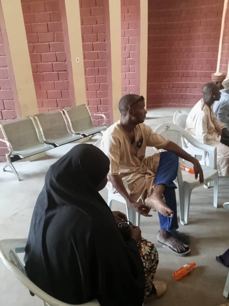 Guests seated along the wall while the meeting was underway.