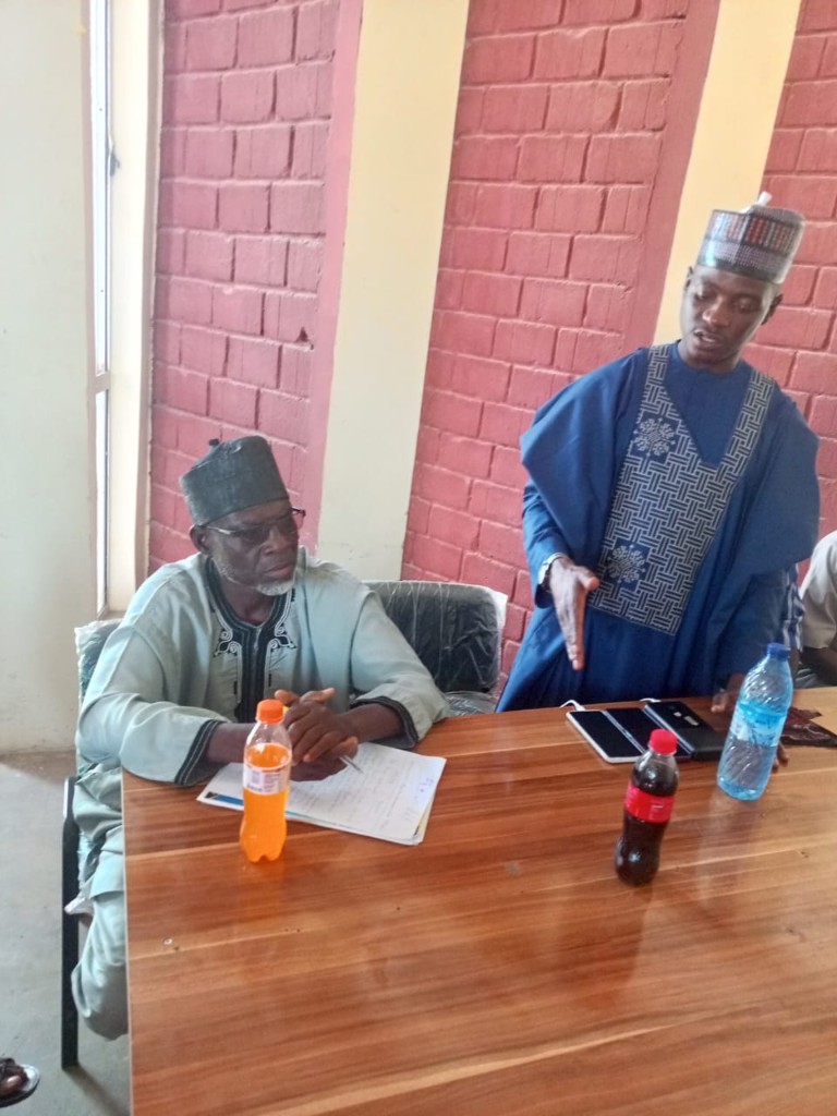 Hon. Aminu Musa with a state executive during the working session.
